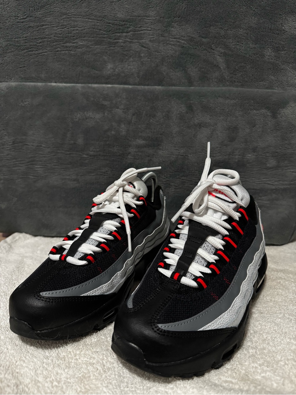 5.5Y or 6.5 womens. Black/Grey Athletic Sneakers with Red Accents
